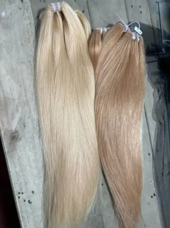 Light blonde and ash blonde straight tape-in hair extensions